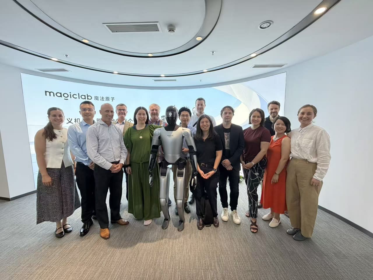 The New Zealand delegation with a humanoid robot at MagicLab's offices in China