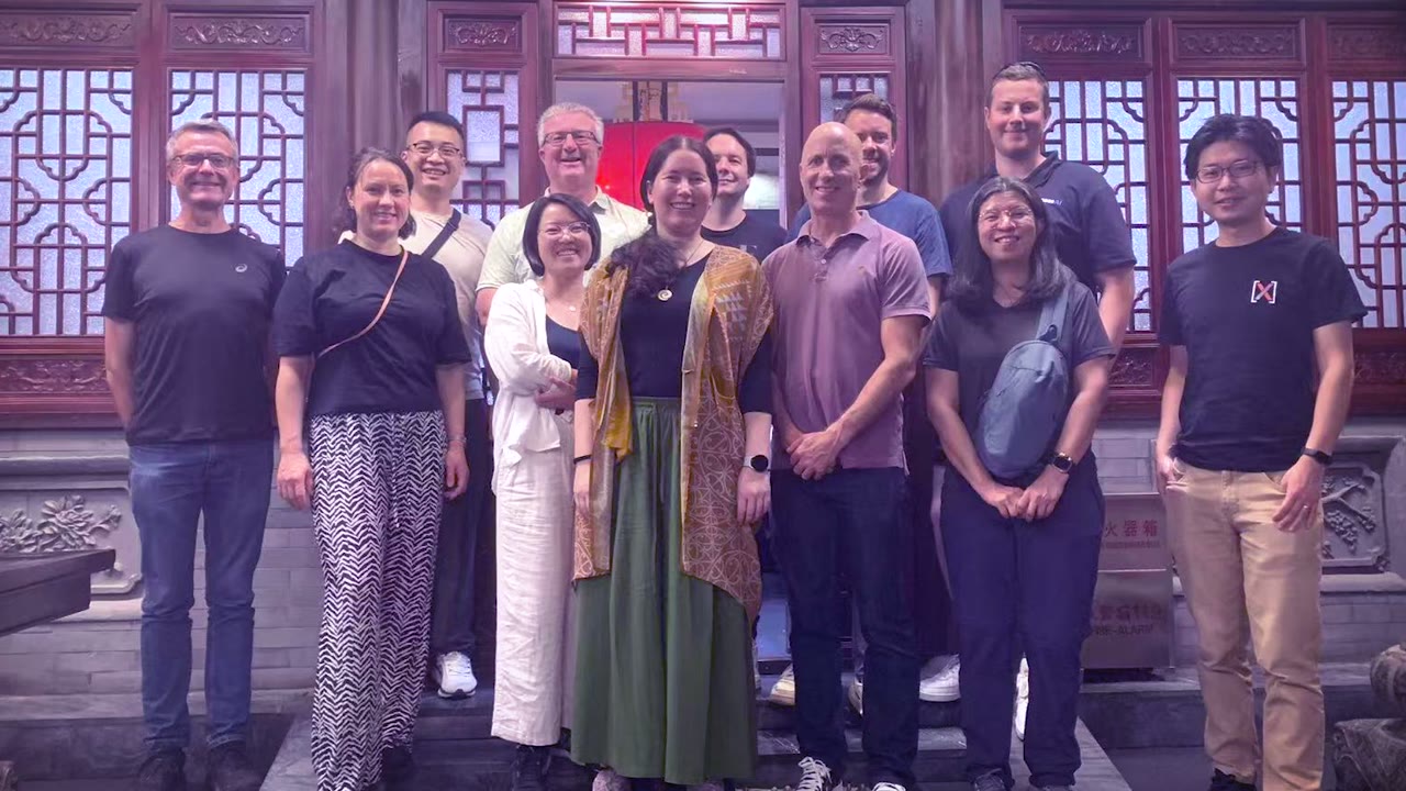 The New Zealand AI delegation group photo in a traditional Chinese courtyard