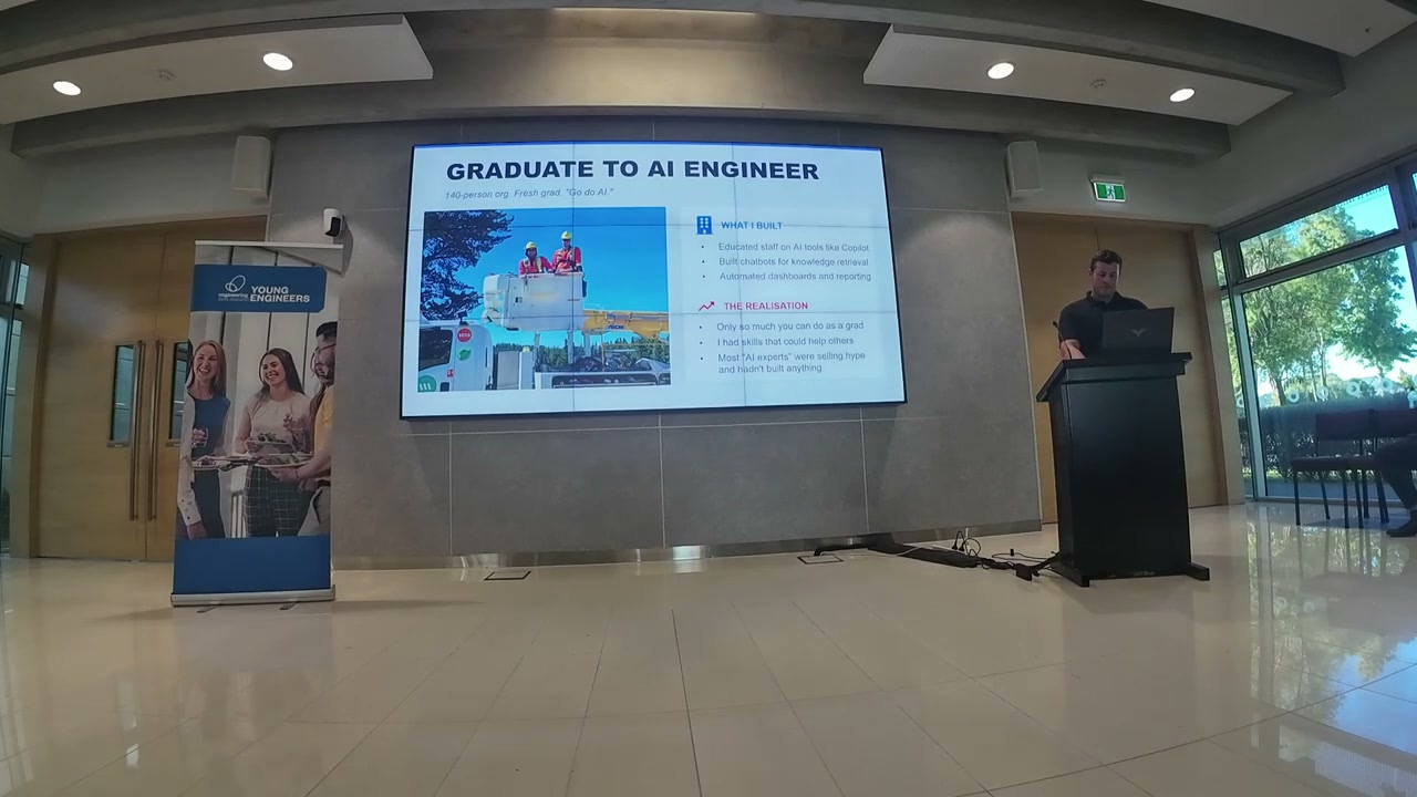 Large presentation screen showing 'Graduate to AI Engineer' title slide