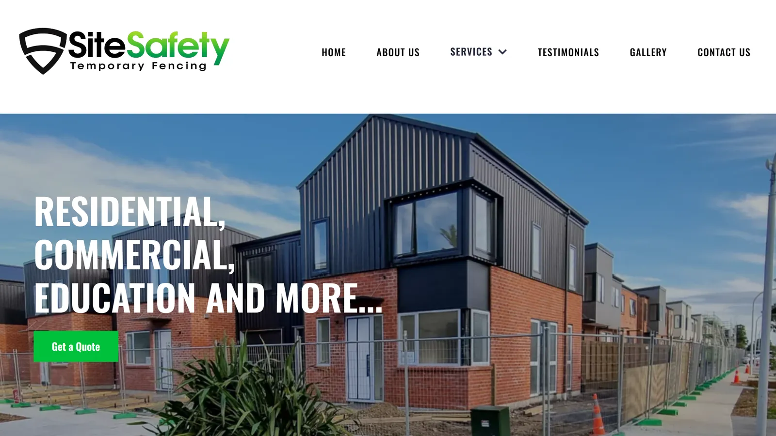 The Site Safety website home page: new brick and dark-clad townhouses behind a line of temporary fencing, under the heading Residential, Commercial, Education and More