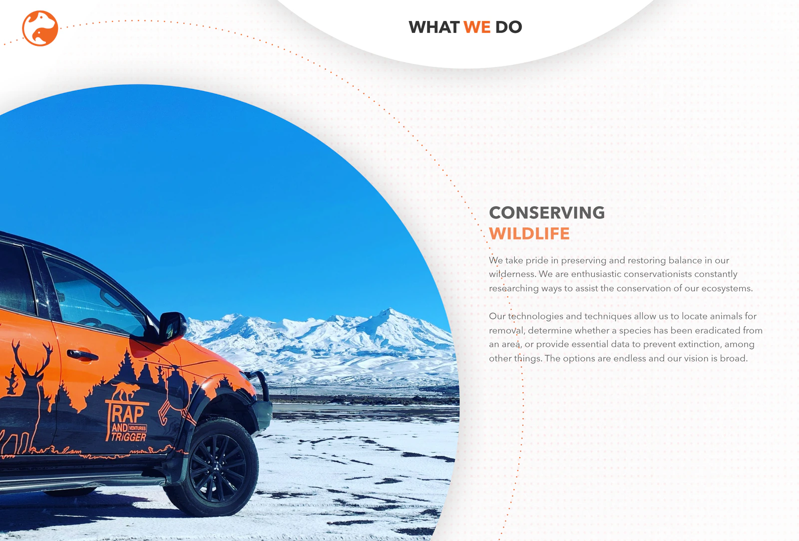 Trap and Trigger's orange branded ute parked in front of snow-covered mountains, from their own website